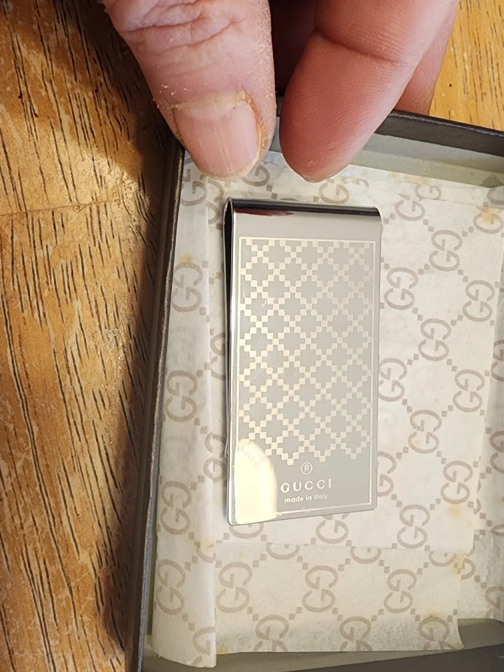 Gucci Diamante money clip featuring the signature diamond pattern and engraved